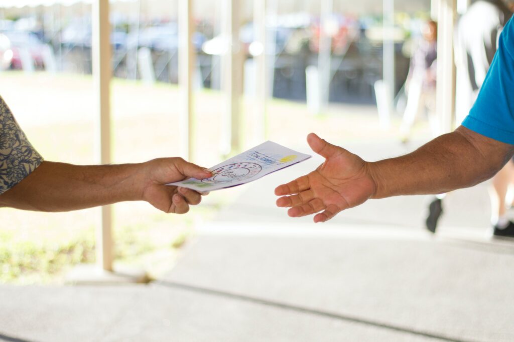 people sharing a brochure to show the shareable nature of print marketing materials
